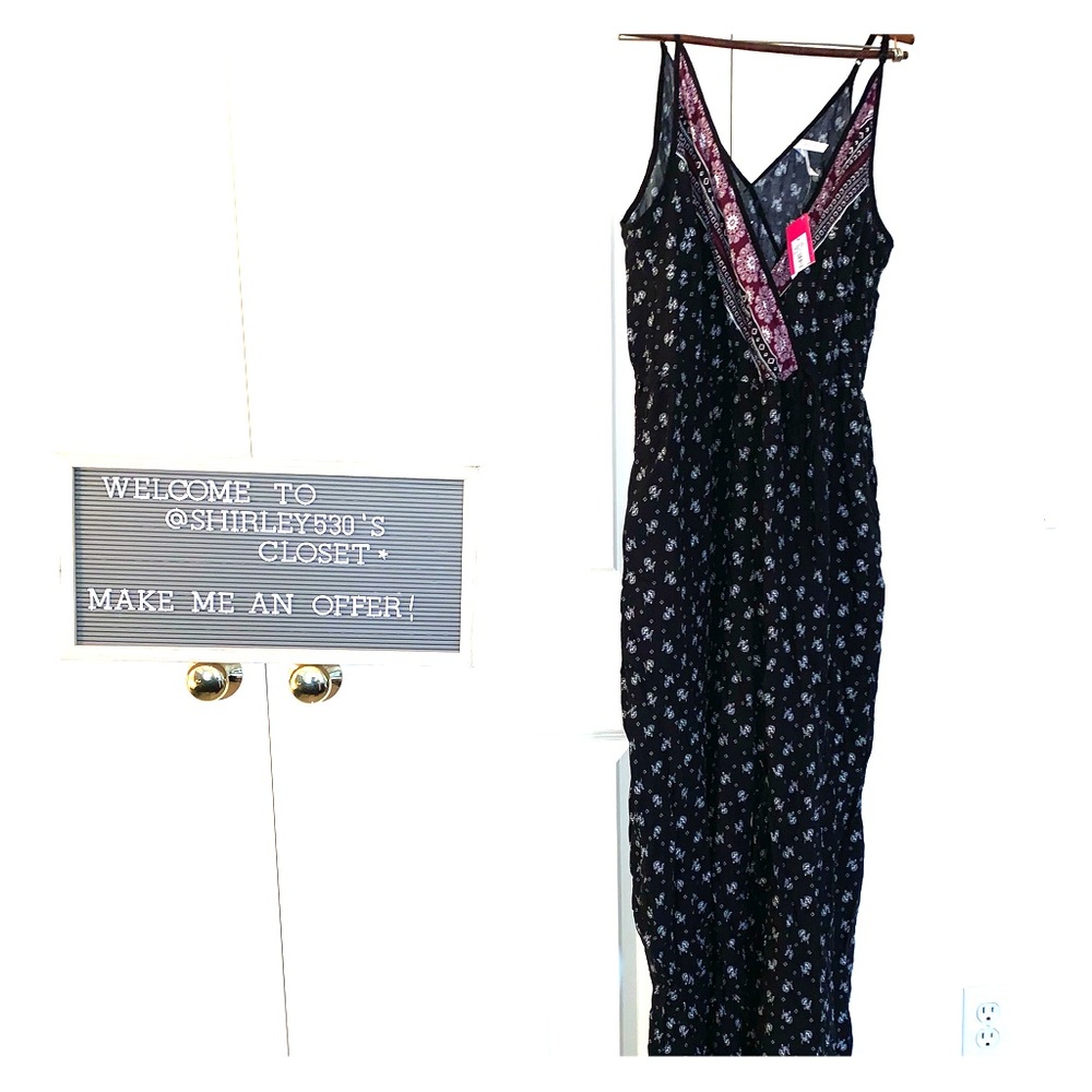 Floral print sleeveless v neck front tie jumpsuit